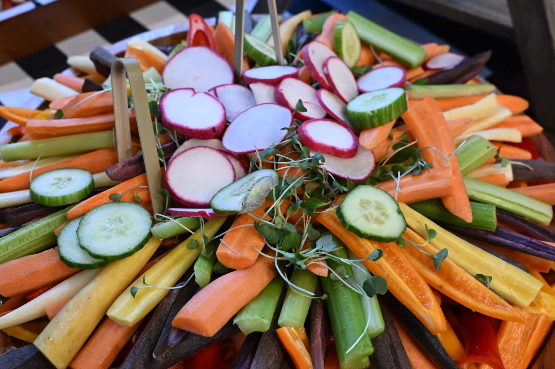 Rainbow crudité platter with heirloom carrots, cucumber and radish