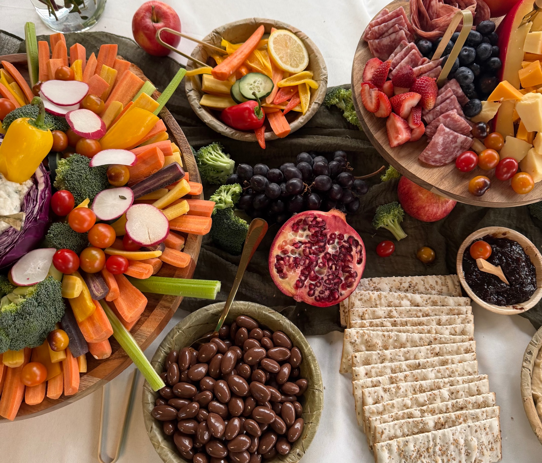 Grazing spread with crackers, pomegranate and chocolate almonds